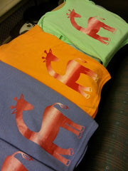 Colourful giraffe t-shirts.